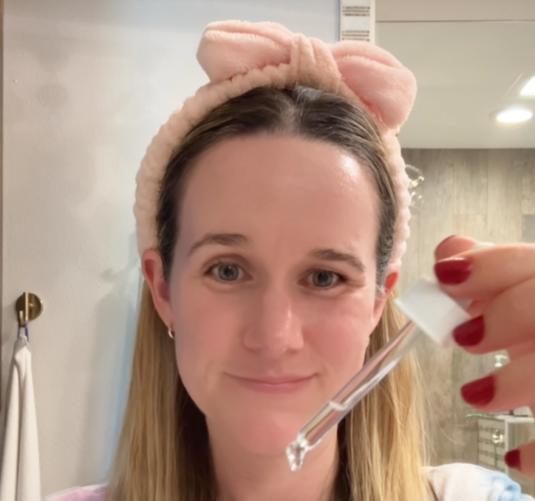 Woman with dehydrated oily skin applying serum to rebalance moisture barrier