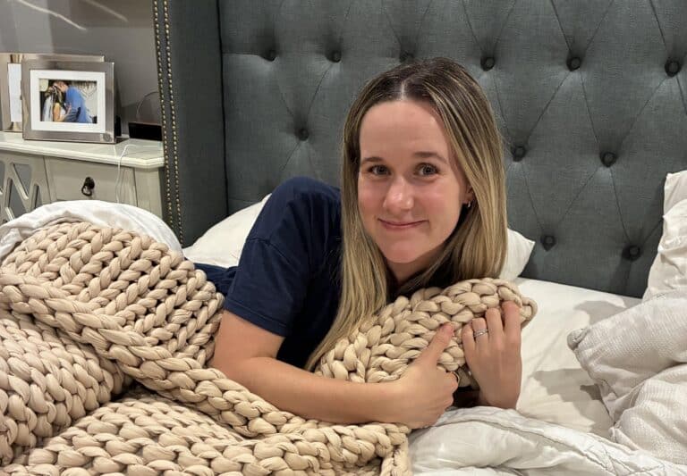 Brittany getting ready to sleep in bed, back position helps prevent sleep wrinkles